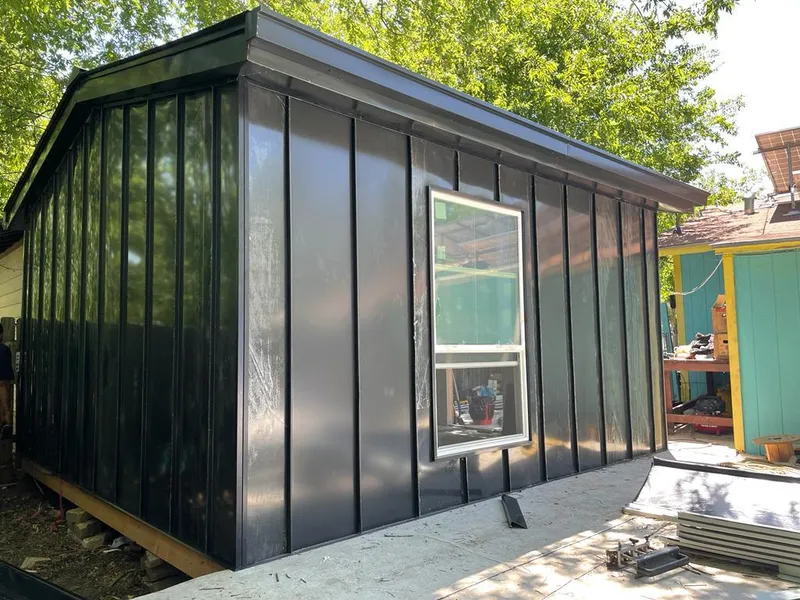 Black standing seam metal wall panels for Roof Inspection in Page